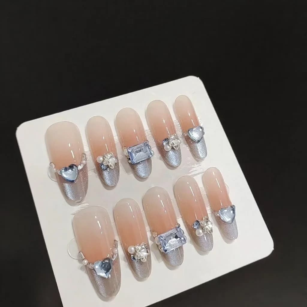 Blaue Bernstein Cat Eye Press-On-Nägel French Tip Strass Lang Oval
