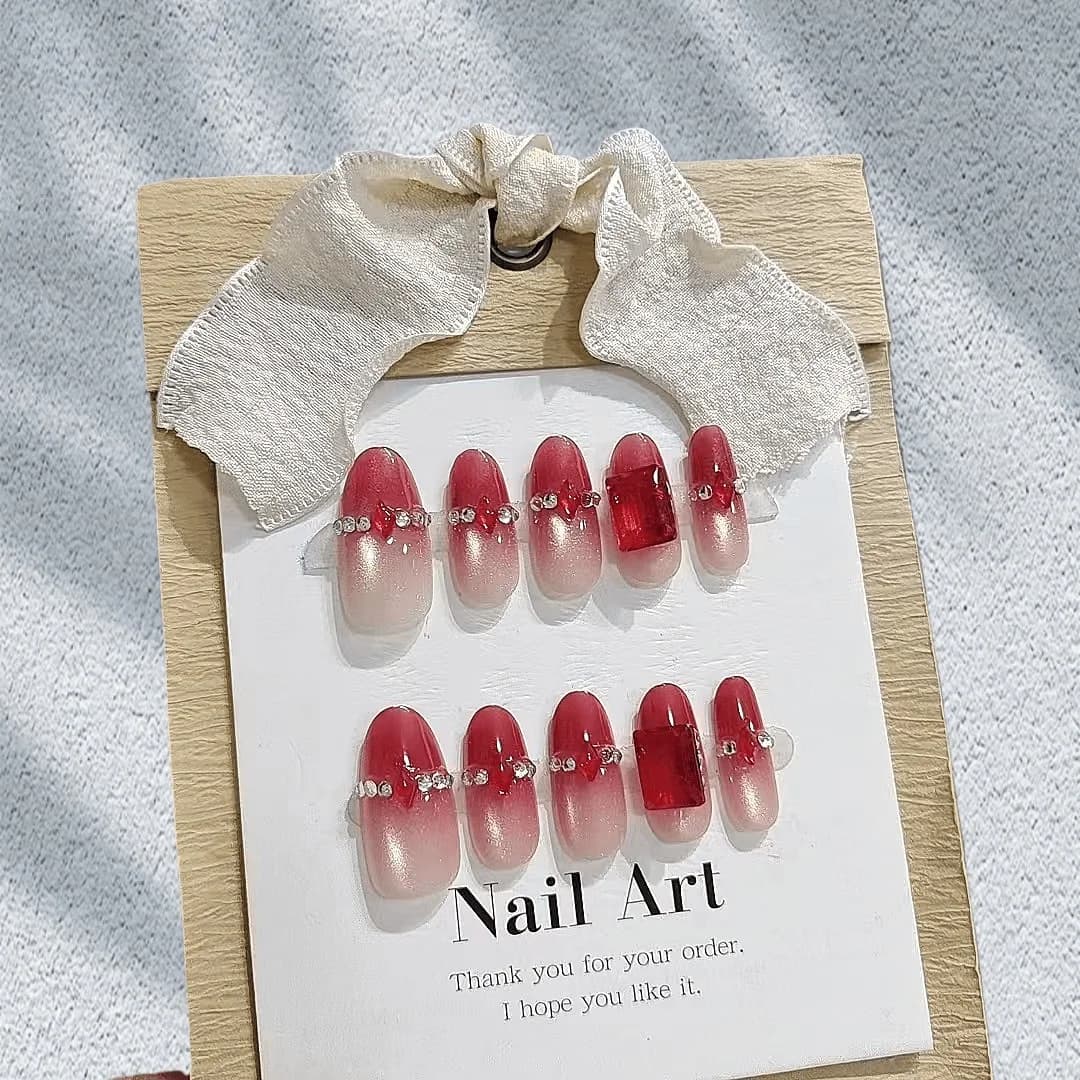 Rote Strass-Katzenaugen-Nägel zum Aufkleben, mittel oval, 30 Stück