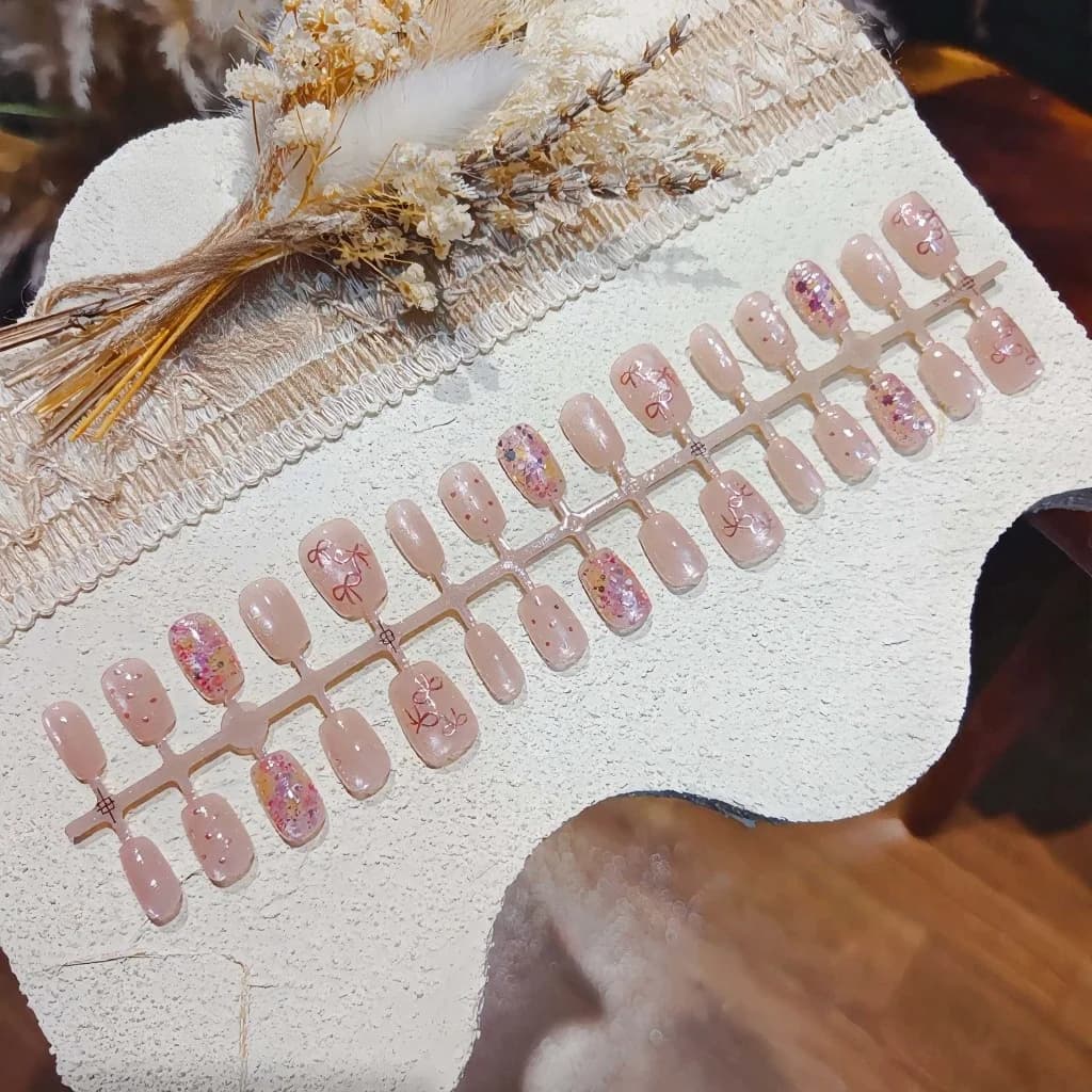 Rosa Schmetterling Press-On Nägel mit Glitzer und Schleife