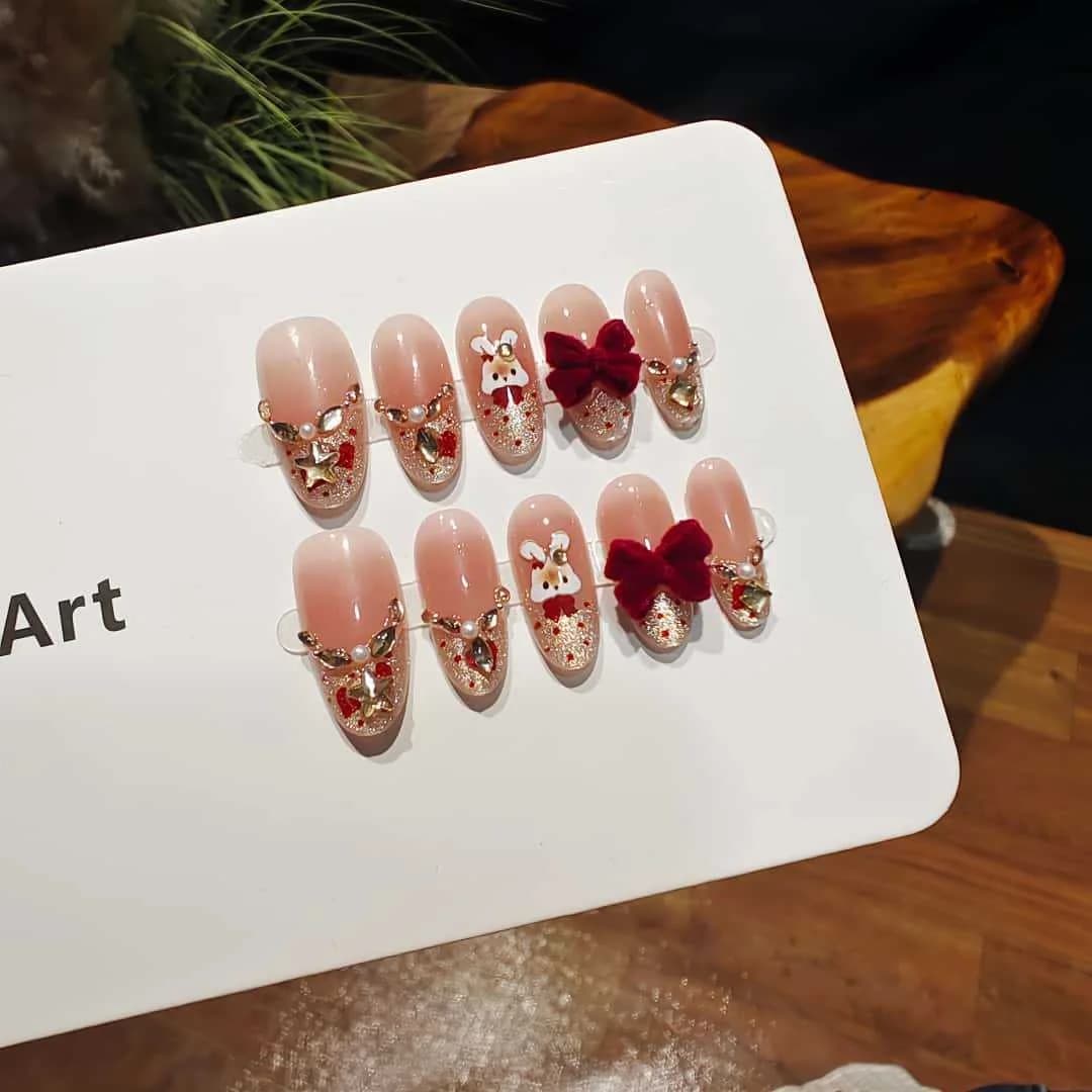 Press-On-Nägel Cat Eye French Tip mit Strass und Schleifen-Design