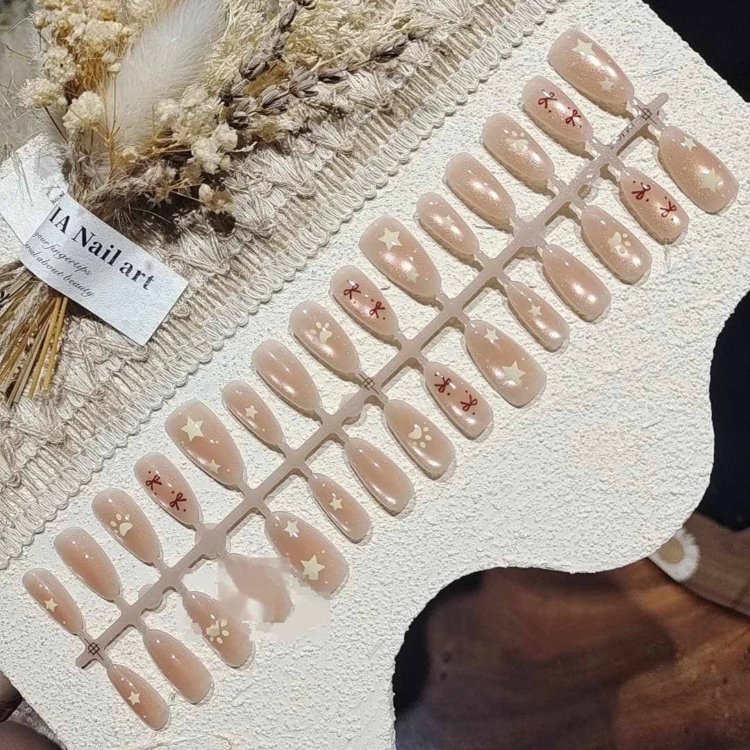 Nude Rosa Cat-Eye Press-On-Nägel mit Schleife und Sternperlen