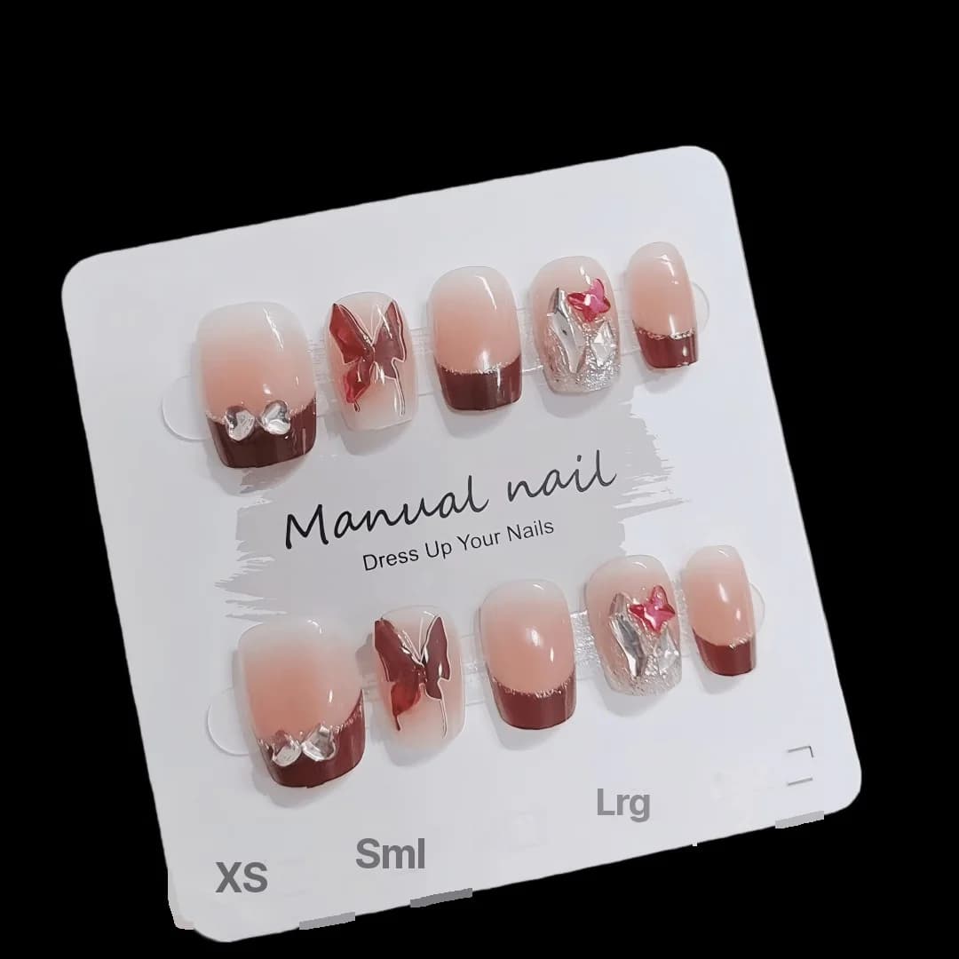 Rote French-Tip-Klebenägel mit Schmetterlings- und Glitzer-Details